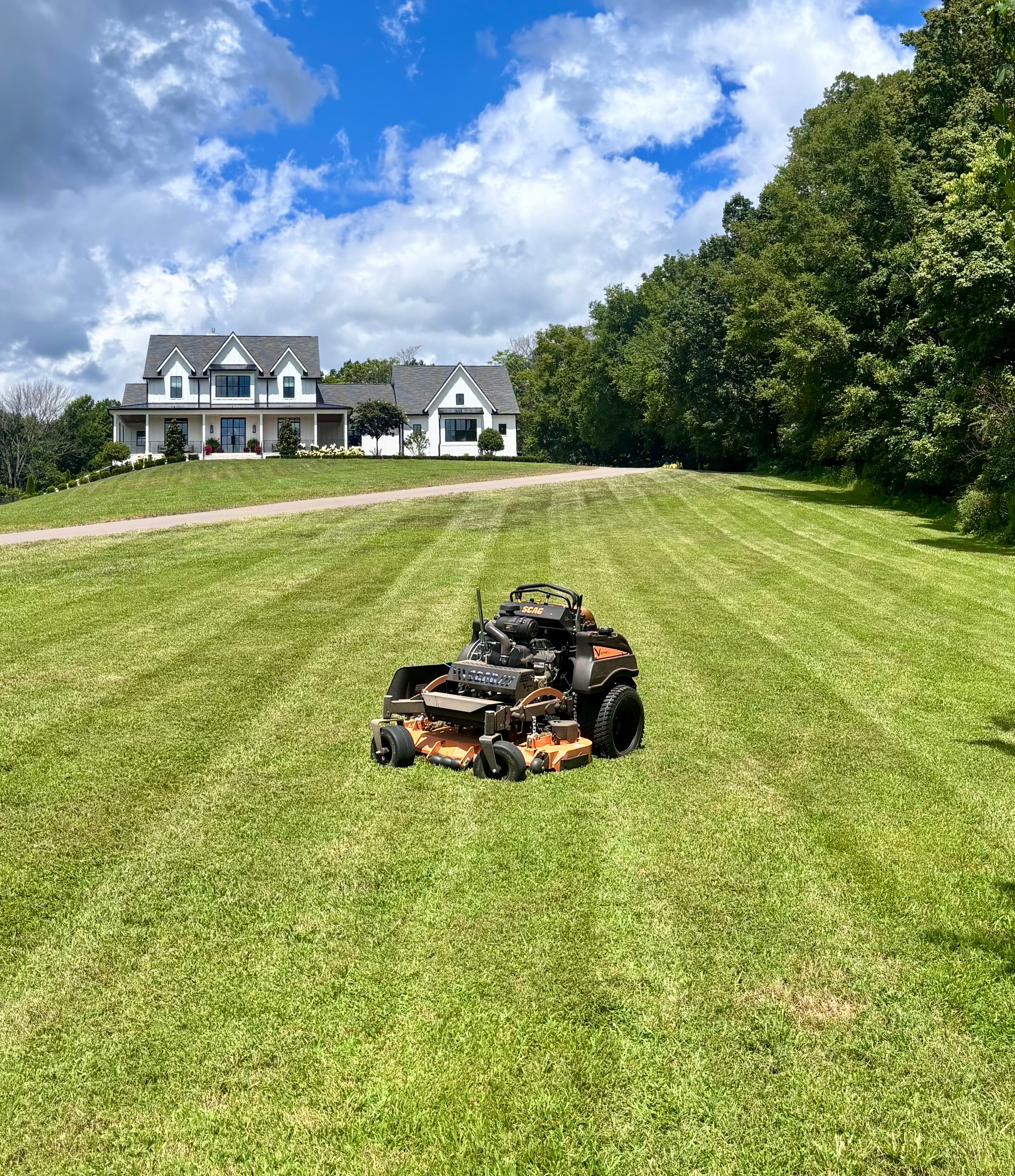 Modern farmhouse with professionally mowed lawn