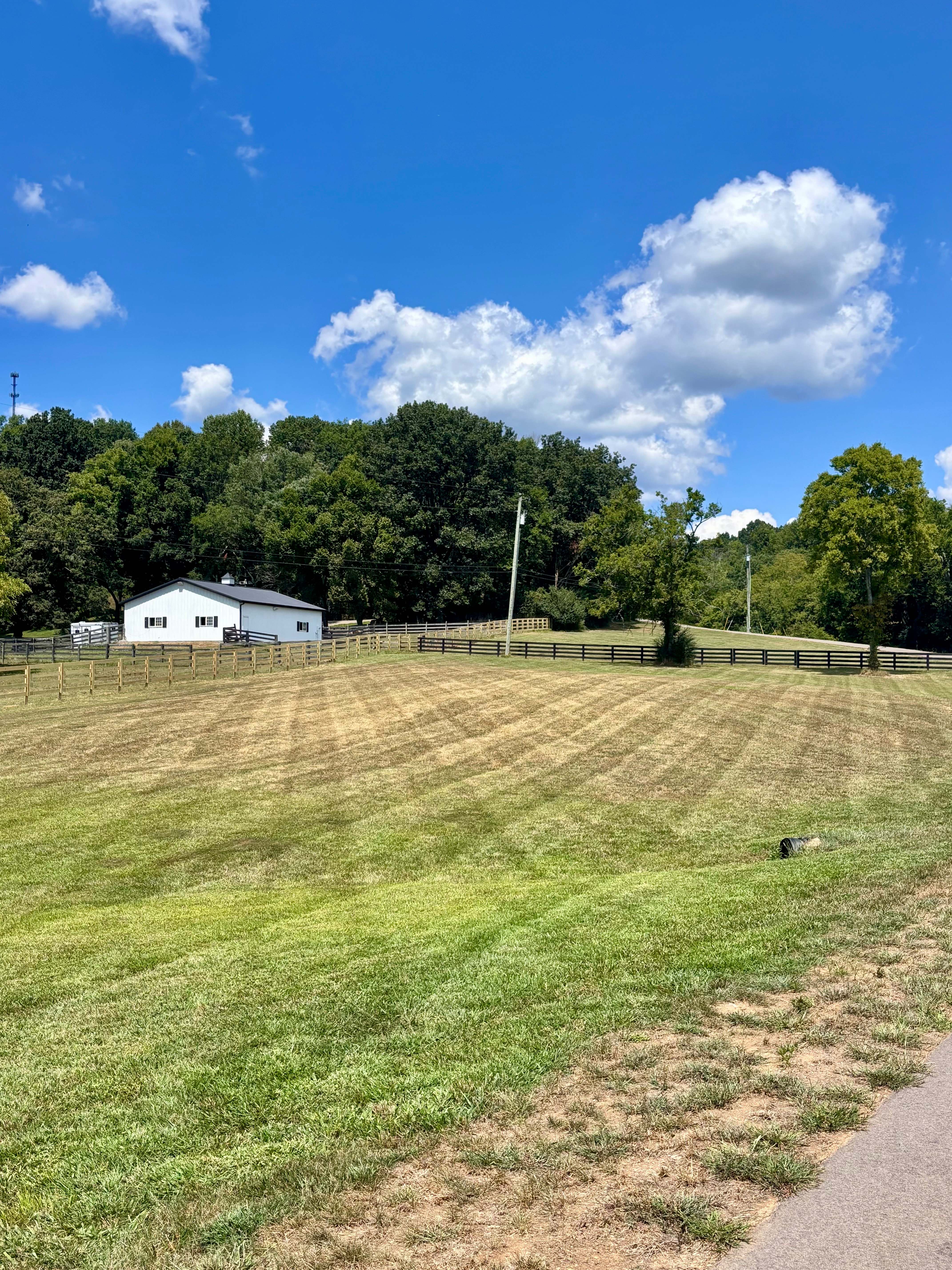 Rural barn property with professional field mowing
